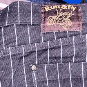 Run and Fly.  Low rider stretch pinstripe unisex skinny jeans.